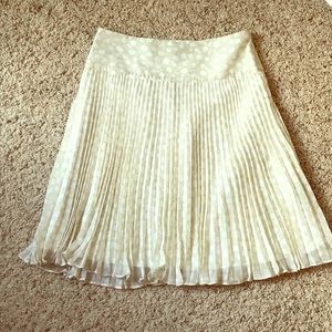 Cream a-line shirt with while polka dots